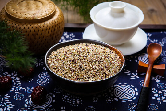 Mixed tri-color quinoa grains in blue ceramic plate