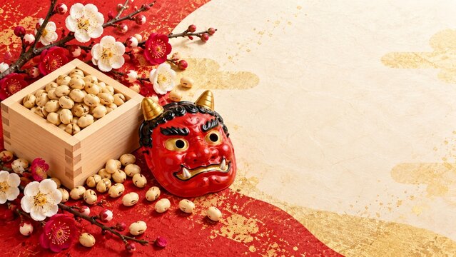 Japanese setsubun festival layout with red oni mask roasted soybeans in masu box and blooming plum flowers on gold red paper background