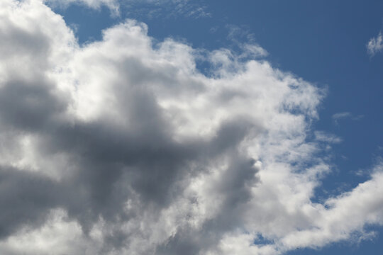 storny cumulus clouds and natural sunlight