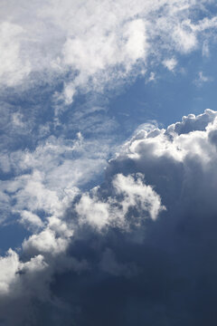 storny cumulus clouds and natural sunlight