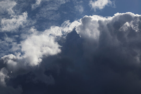 storny cumulus clouds and natural sunlight