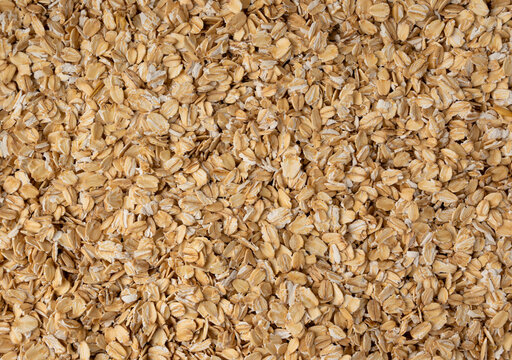 Oat flakes textured pattern, rolled oatmeal macro background
