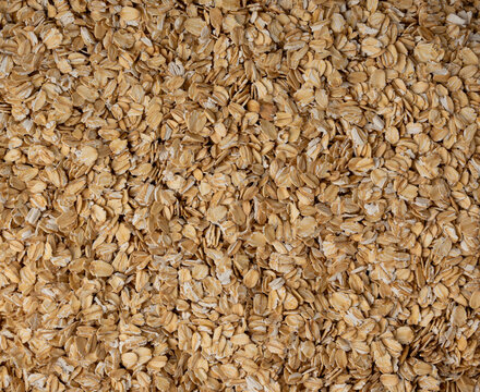 Oat flakes textured pattern, rolled oatmeal macro background