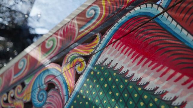 Slow motion close up of painted patterns on kolae boat in Pattani Thailand