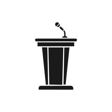 This image is a minimalist, black-and-white vector icon depicting a speaker's podium or lectern equipped with a microphone on top. The clean silhouette and professional design make it a versatile 