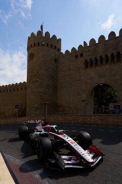 BAKU, AZERBAIJAN - SEPTEMBER 2026: MoneyGram Haas F1 Team race car turns through the narrow Old City castle section during the Azerbaijan Grand Prix