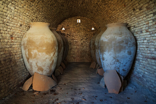 Qvevri wine vessels staged inside brick kiln in Georgia