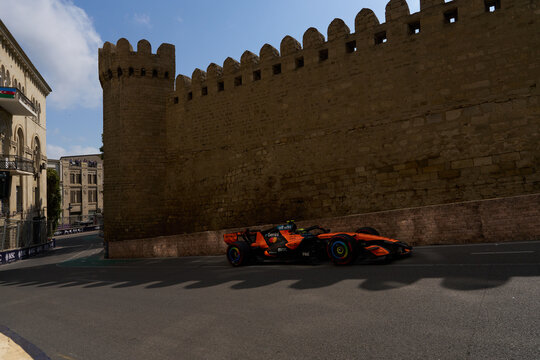 BAKU, AZERBAIJAN - SEPTEMBER 2026: McLaren F1 Team car races along the historic Old City castle wall during the Azerbaijan Grand Prix