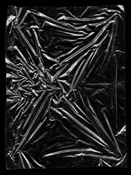 Transparent Plastic Shrink Wrap Texture Overlay on Black
