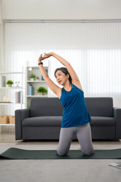woman doing fitness exercises at home. healthy lifestyle concept