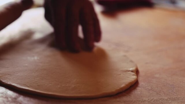 The process of making Traditional Balkar khychin, a thin stuffed flatbread from the North Caucasus, being prepared and cooked in a kitchen in slow motion video. Balkar cuisine and traditional food..