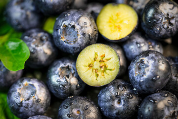 Close up Premium fresh blueberries on wooden background. Organic dark berry loop concept for healthy dessert recipes and gourmet food marketing. © MERCURY studio