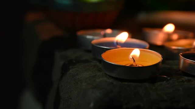 Traditional clay oil lamps with glowing flames creating a warm and festive atmosphere during Diwali celebrations