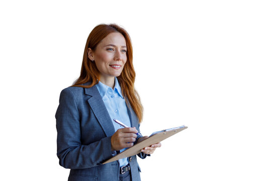 Businesswoman standing, writing on clipboard, planning future