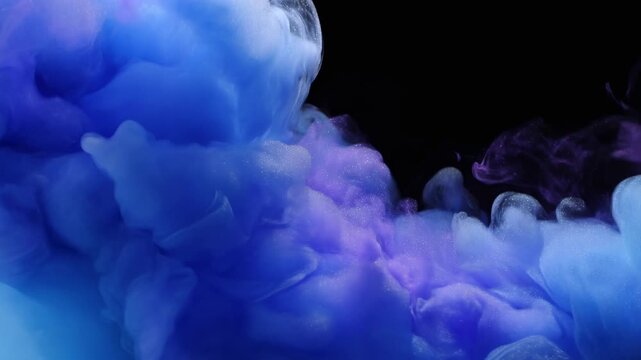 Blue and purple ink clouds swirl and diffuse across a black background. Motion graphics, title sequence, and meditation media.