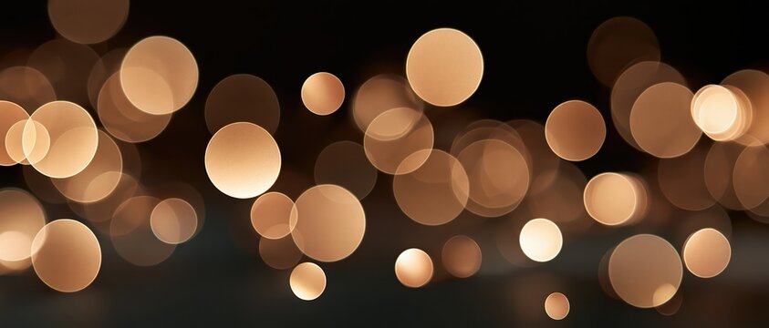 Luxurious warm golden bokeh orbs float against deep black, evoking festive glamour and nightlife magic. Perfect for holiday campaigns, luxury branding, event invitations, and atmospheric.