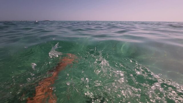 POV crawl freestyle swimming in crystal sea, Italy