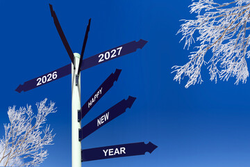 Happy new year 2027 on direction sign, snowy trees, winter greetings © Delphotostock