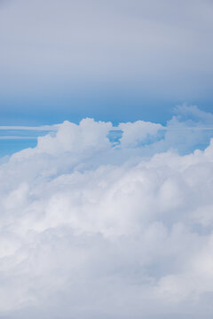 Aerial view of dense white cumulus clouds filling the sky above Choco, Colombia.