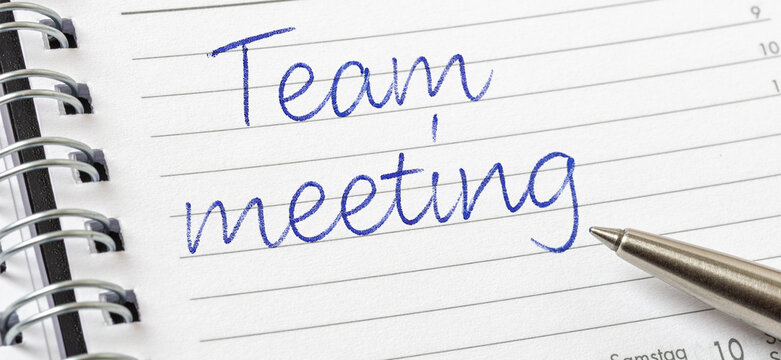 Team meeting written on a calendar page