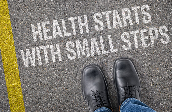 Text on the road - Health starts with small steps