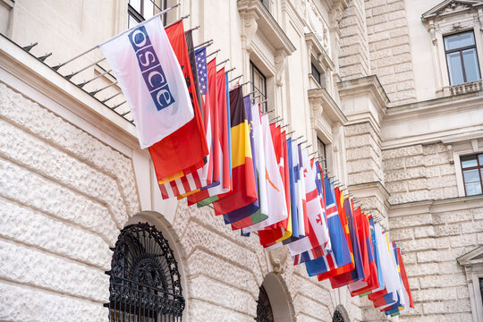 Vienna, Austria, October 26, 2024: OSCE flag and participating states&rsquo; flags outside the Hofburg conference venue during Austrian National Day.