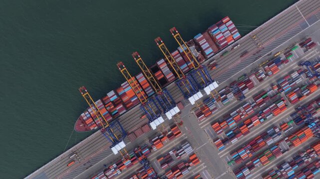Aerial top down view of container ship unloading at hai phong port