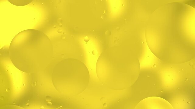 Bright golden oil drops drift and orbit across a vibrant water surface, refracting light and creating an abstract loopable background animation
