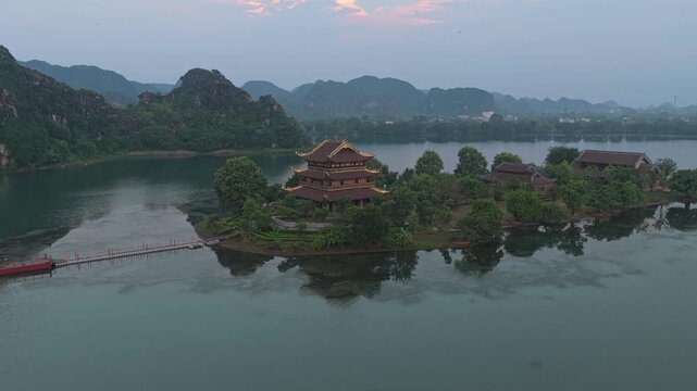 Aerial view of golden pagoda at sunrise in hoa lu vietnam