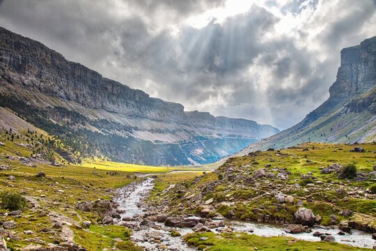 Hiking trail in Spain. Ordesa valley in Spanish Pyrenees. Glacial cirque of Ordesa y Monte Perdido National Park. Spectacular weather.