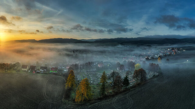 Autumn nature at sunrise in the fog