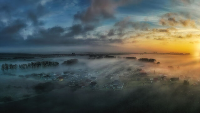 Autumn nature at sunrise in the fog