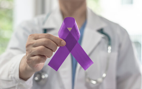 Purple awareness ribbon on doctor hand for Pancreatic cancer, Epilepsy, ADHD, Lupus, Crohn's, World Alzheimers day (month) and World cancer day