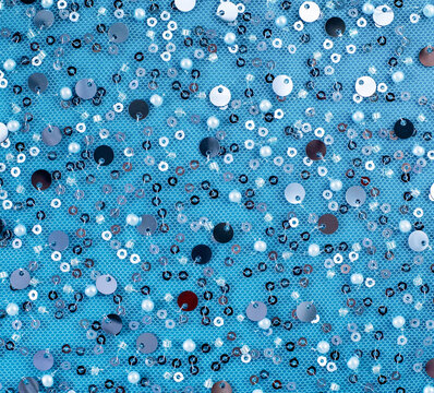Blue sequin fabric with silver scattered sparkling round pattern