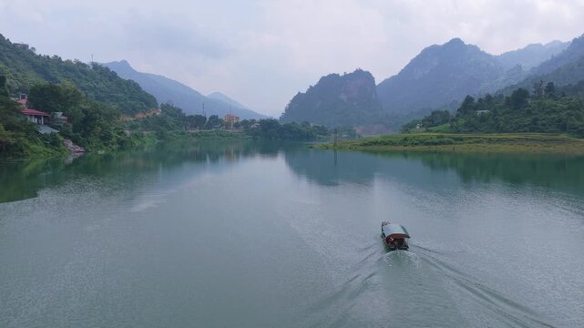 Traditional vietnamese boat sailing on a river in bac mei
