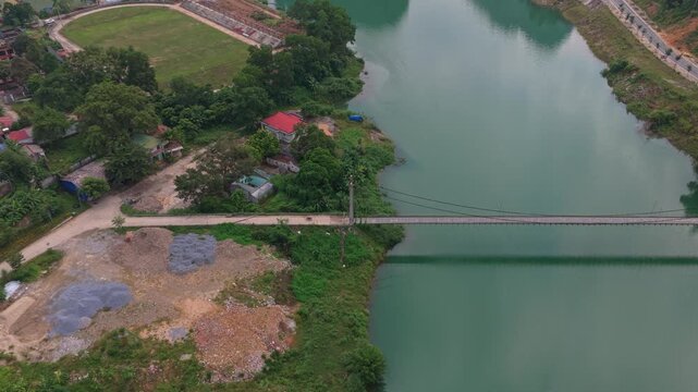 Aerial view of suspension bridge over river in bac me vietnam