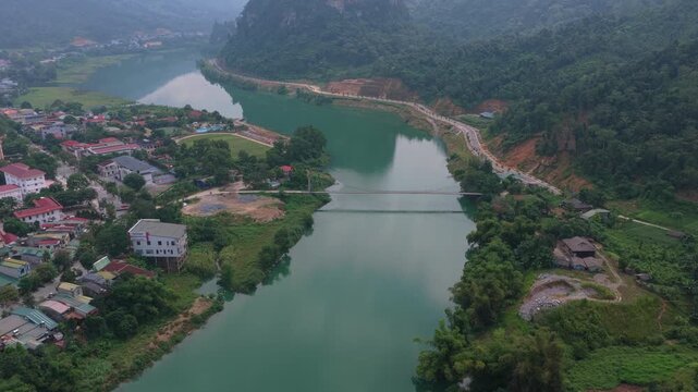 Aerial view flying over a green river in bac me vietnam