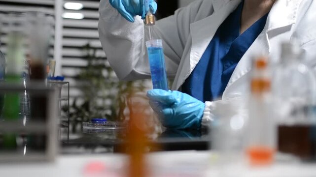Science, laboratory and woman with pipette, test tube and biotech solution in research. Medical innovation, scientist or lab technician in study for healthcare, medicine and vaccine results feedback.