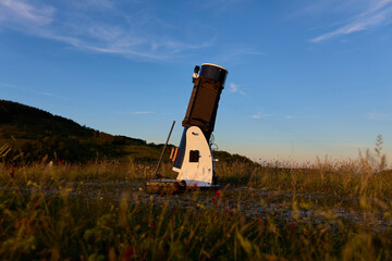 Amateur astronomy telescope during sunset preparing for night observations of stars, Milky Way, Moon and Planets. © astrosystem