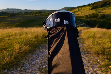 Amateur astronomy telescope during sunset preparing for night observations of stars, Milky Way, Moon and Planets. © astrosystem