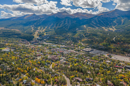 Aerial view of the town of Breckenridge nestled in the Rocky Mountains with autumn foliage and ski slopes in Breckenridge, Colorado, United States.