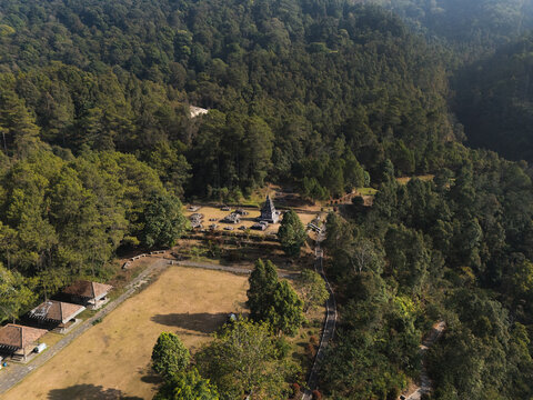 Aerial view of the historic Gedong Songo Temple complex nestled within the lush, dense forests of Mount Ungaran in Bandungan, Jawa Tengah, Indonesia.