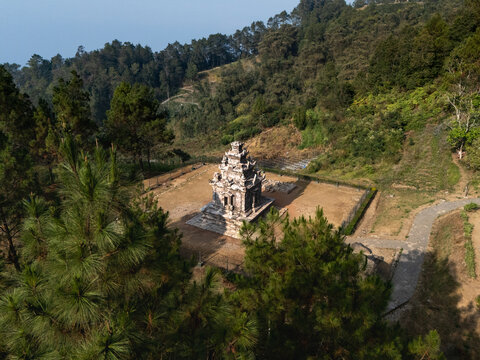 Aerial view of the historic Gedong Songo Temple complex surrounded by lush pine forests on the slopes of Mount Ungaran in Bandungan, Jawa Tengah, Indonesia.