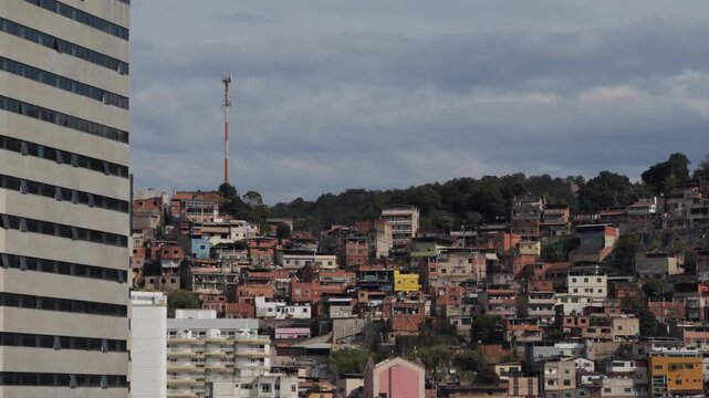 Modern Residential Tower Facing Dense Hillside Favela Neighborhood