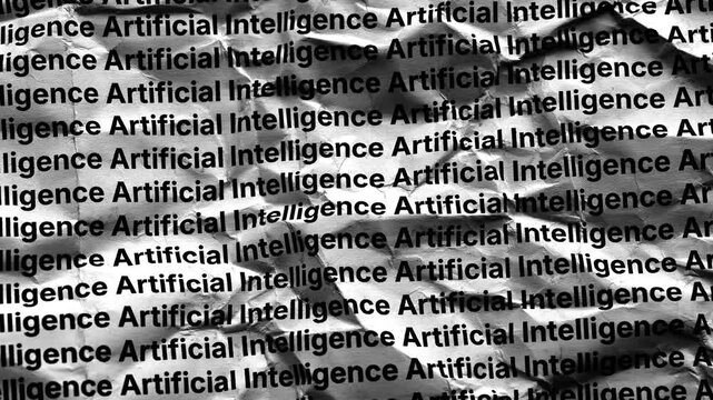 A crumpled paper texture background with repeating rows of the black text Artificial Intelligence. Black and white. Close up.