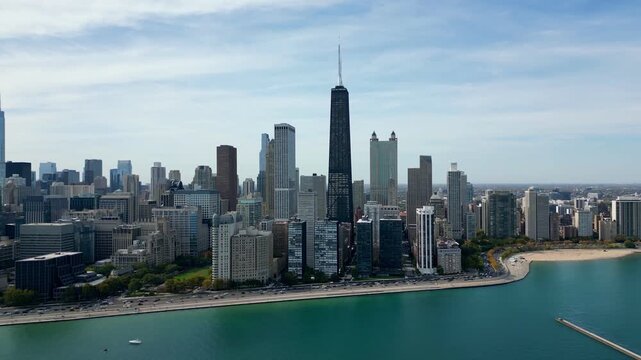 drone flying slow towards chicago skyline on a bright summer day