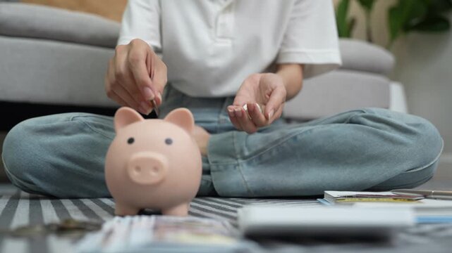 A woman holds a piggy bank, which symbolizes savings, financial planning, and economic challenges. Budgeting, investing, and money management for a secure future.