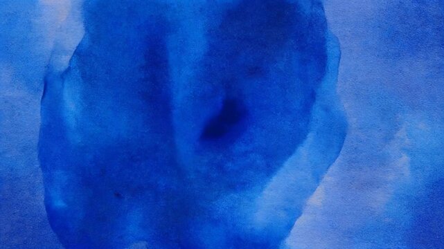 Deep Blue Watercolor Pigment Spreading Across Textured Paper