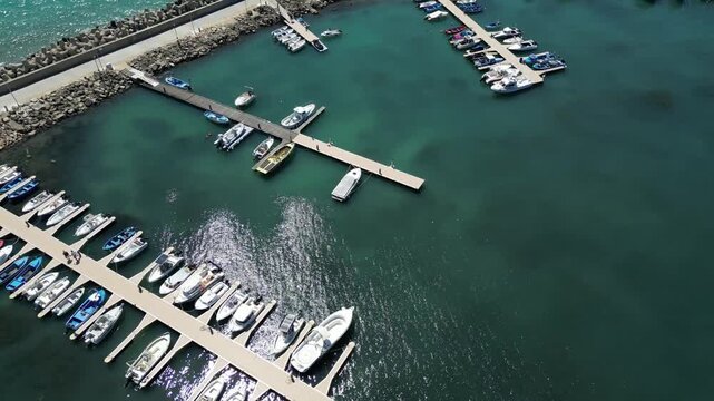Aerial View of Marina Harbor with Boats and Yachts in Turquoise Sea Water