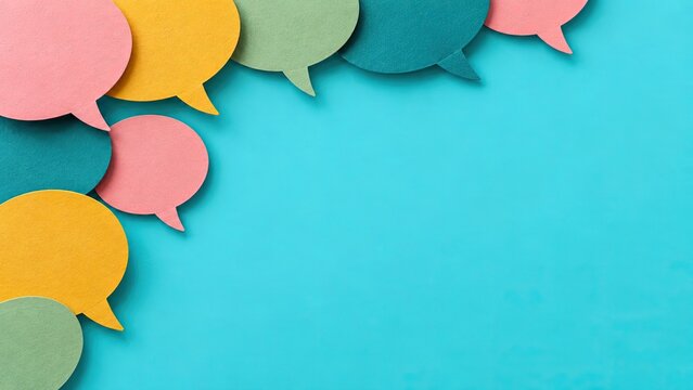 Colorful speech bubbles arranged on vibrant blue surface with empty space for creative communication and text messaging design projects or social interaction.